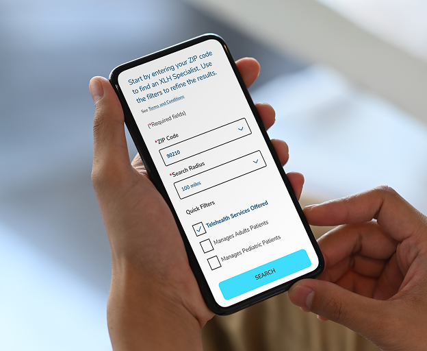 A smartphone with the Find an XLH Specialist page on the screen